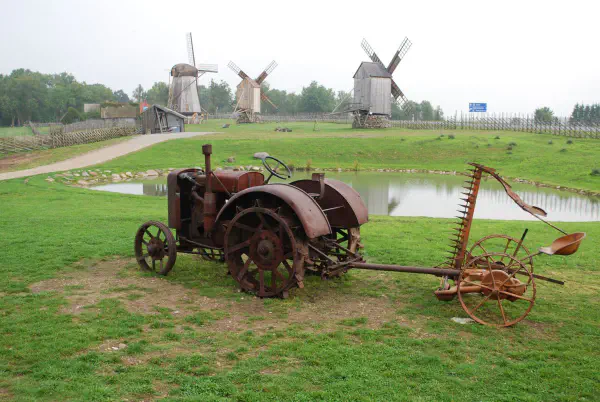 Old tractor in front of Angla Tuulikud (windmills of Angla)