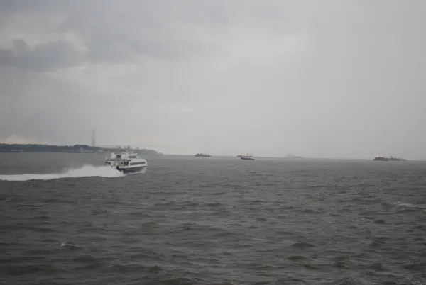 The Verrazano-Narrows Bridge, connecting Brooklyn to Staten Island, just visible in the rain