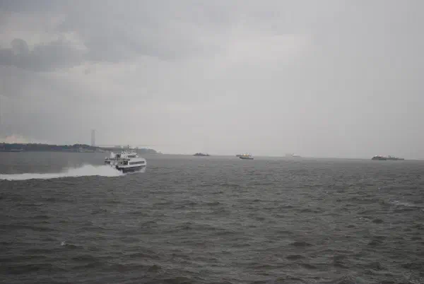 The Verrazano-Narrows Bridge, connecting Brooklyn to Staten Island, just visible in the rain