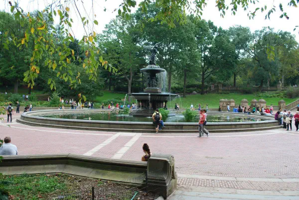 A fountain next to The Lake at Central Park